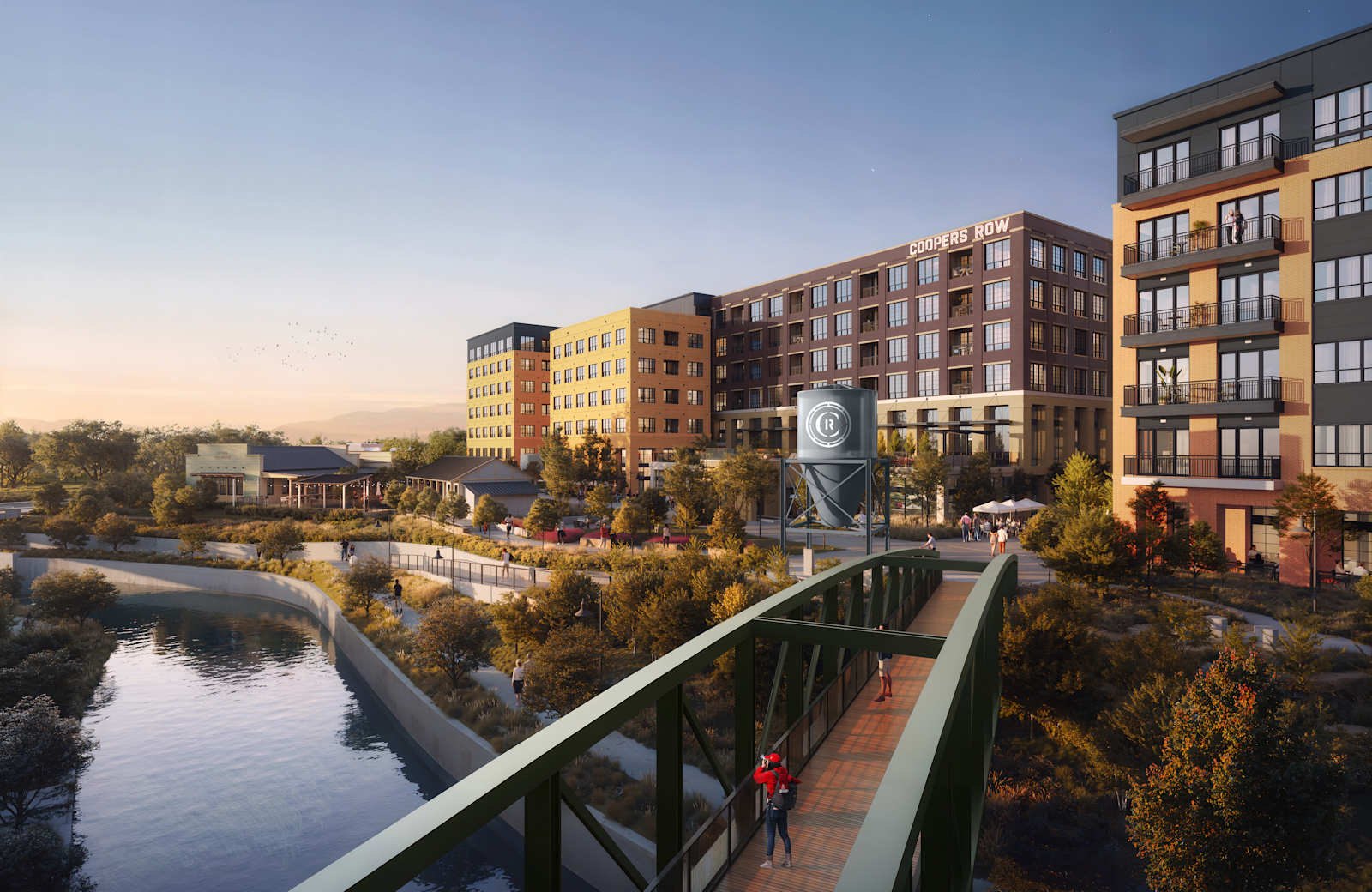 The development seen across the river and bridge, COOPERS ROW on the central facade