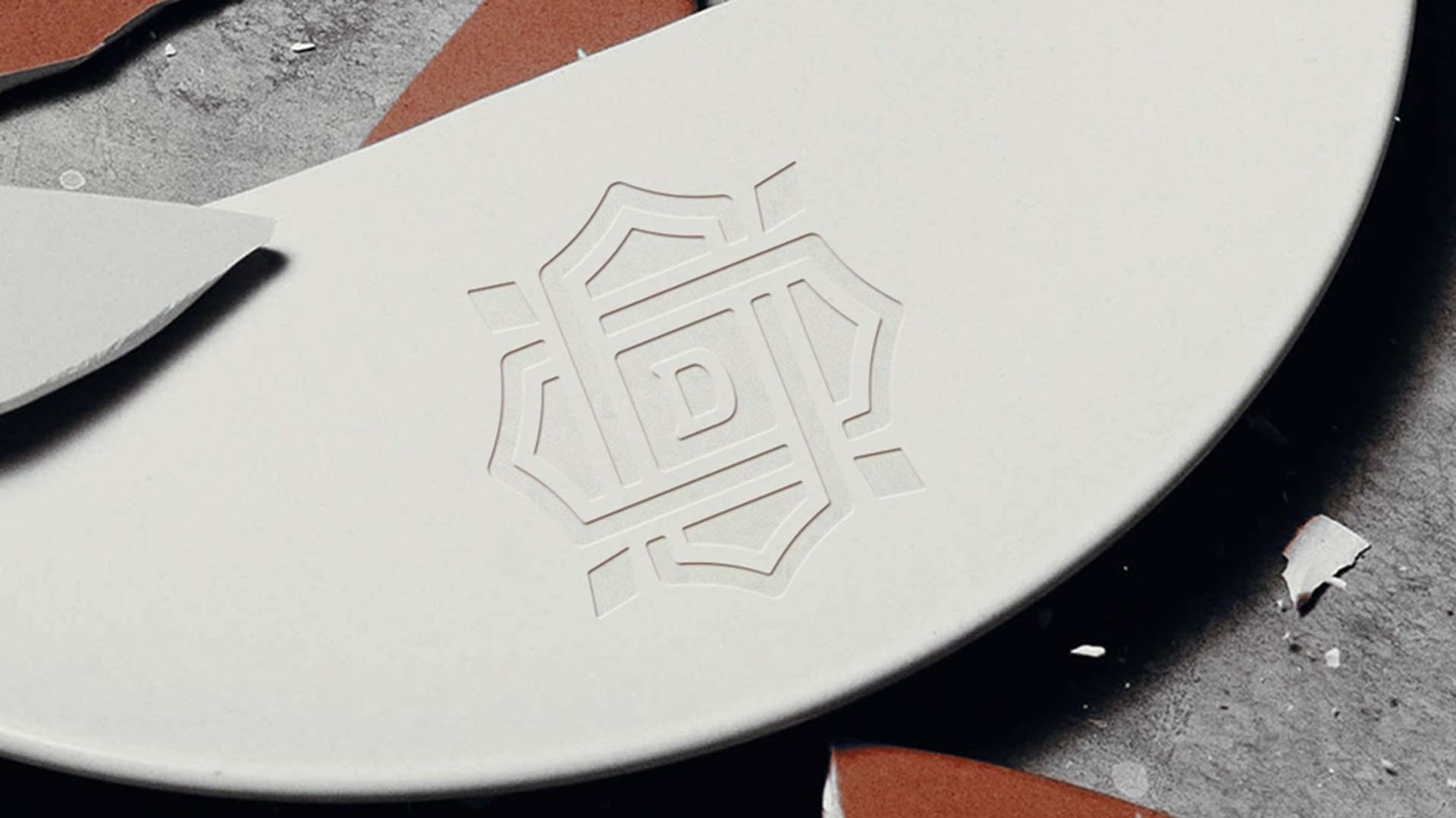 The Domingo monogram debossed into the tableware