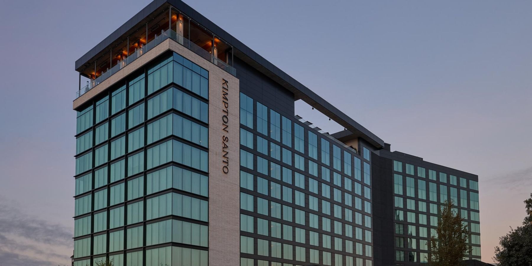 The Kimpton Santo exterior with the vertical KIMPTON SANTO sign, San Antonio